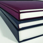 Image showing the different hard back sizing and coloring options. A close up of the spine.